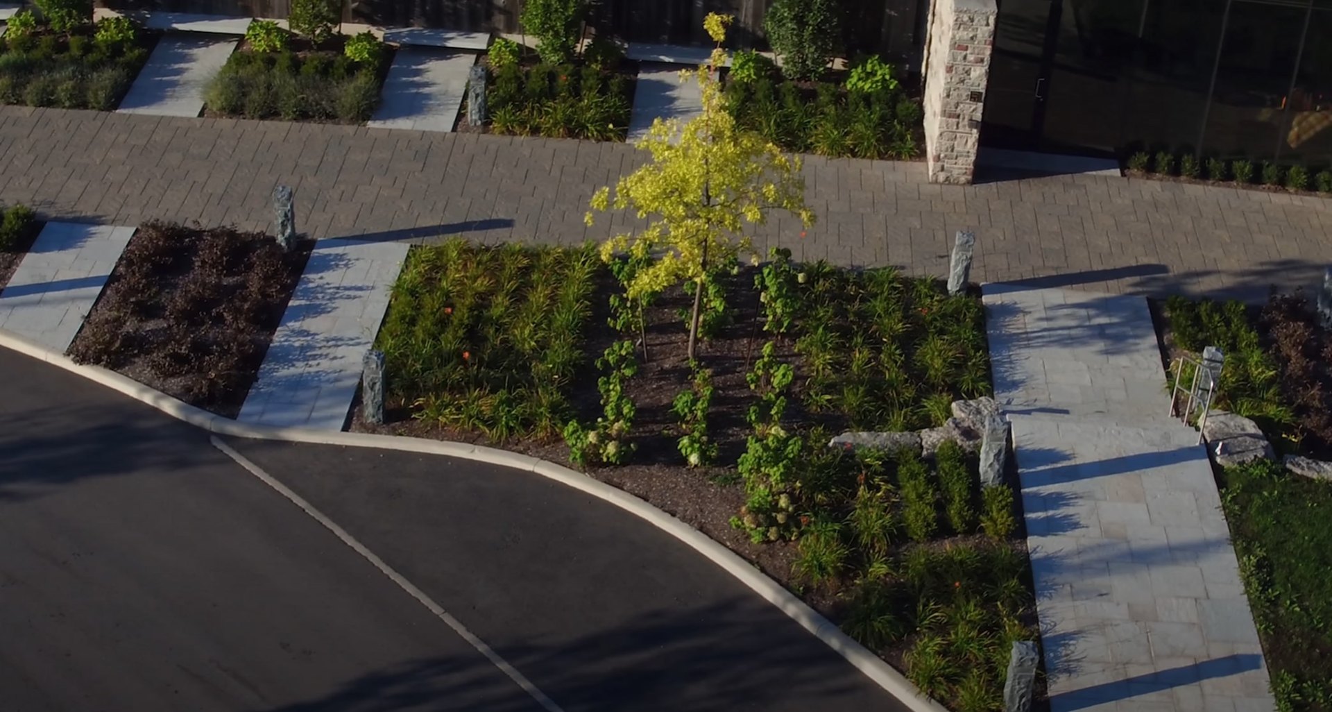 Large Scale Commercial Landscaping Project Aerial view of commercial landscape project with modern hardscaping and organized planting beds