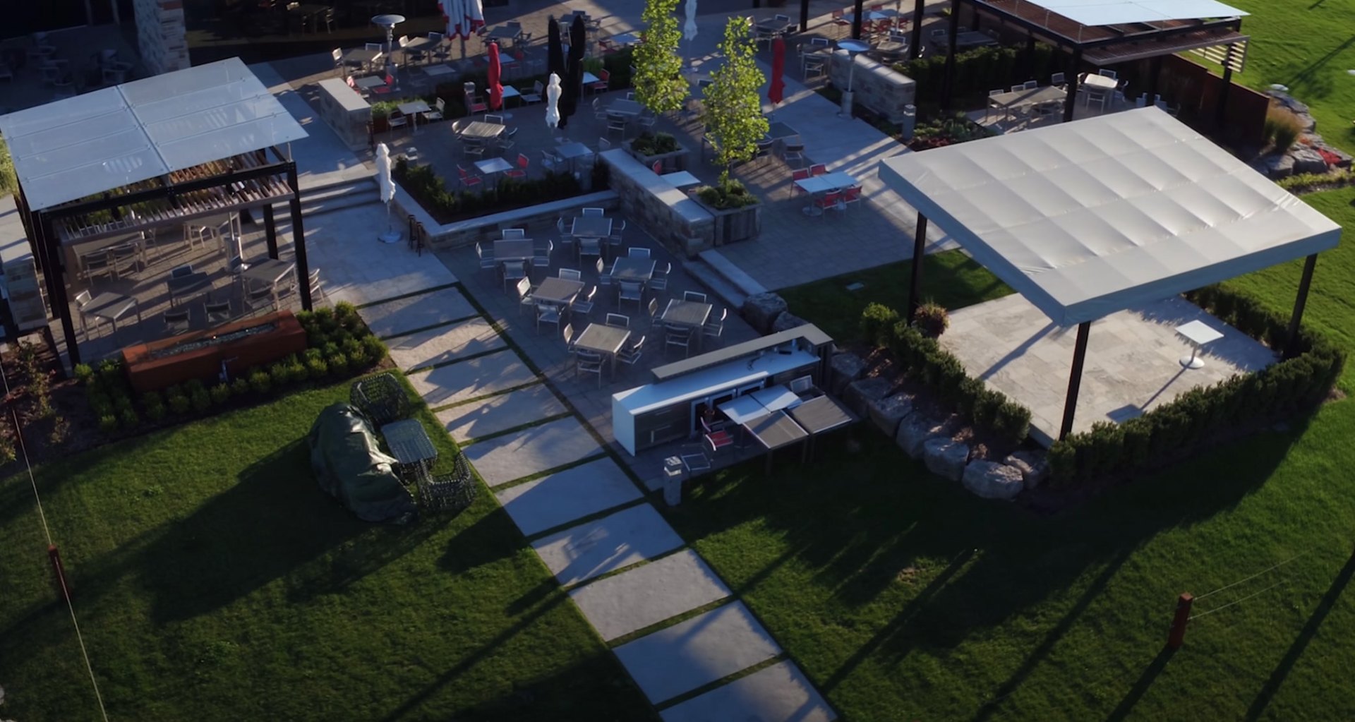 Premium Outdoor Living and Entertainment Area Luxury outdoor living space with fire pit, seating area, and professional landscape lighting