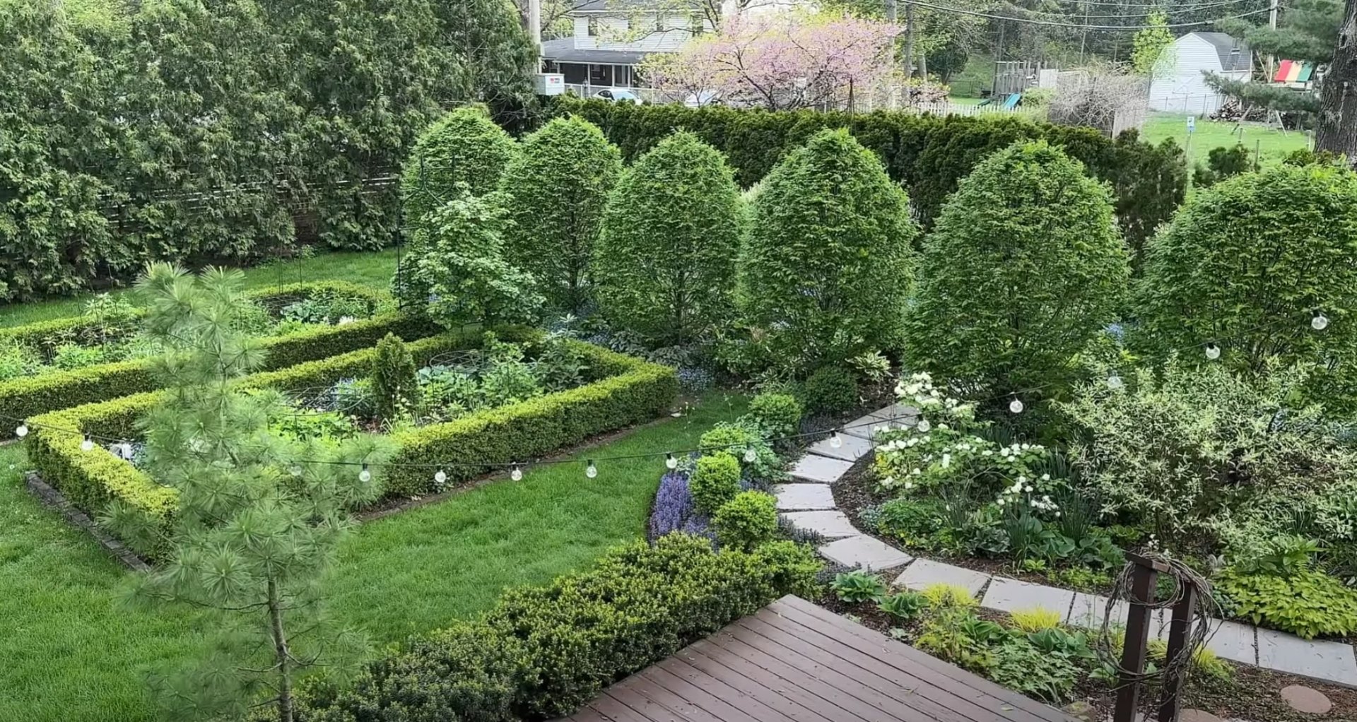 Formal Garden Design with Geometric Layout Aerial view of expertly designed formal garden with geometric patterns and lush landscaping