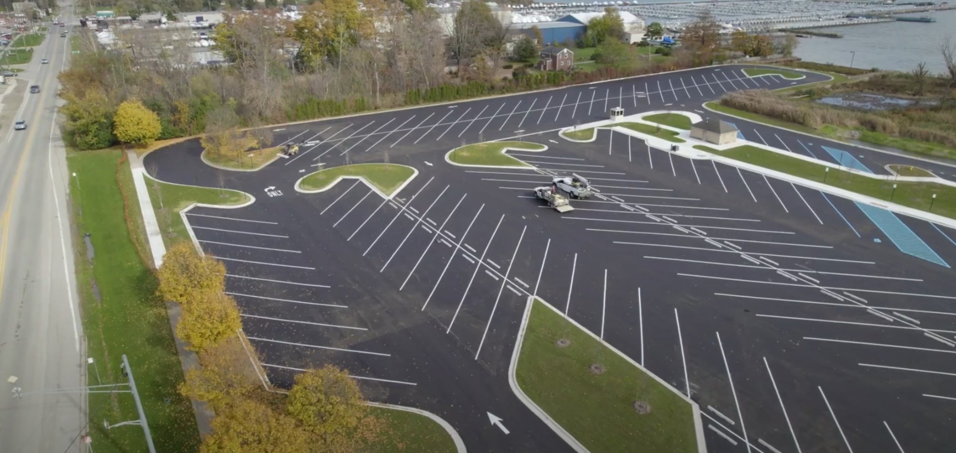 Commercial Landscaping and Site Development Commercial landscape installation showing organized parking lot design with integrated green spaces